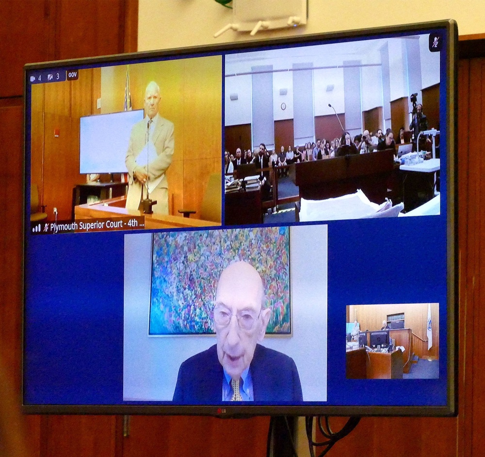A screen shows defense attorney Kevin Reddington as he interviews witness Phillip Resnick, on remote feed, from Cleveland (Reuters)