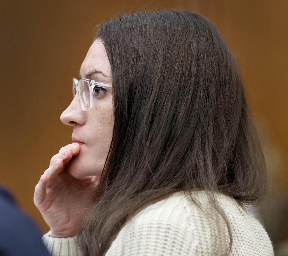 Clancy listens to forensic psychologist Dr. Kirk Heilbrun testify about the voices she says she heard before she strangled her three children (Reuters)