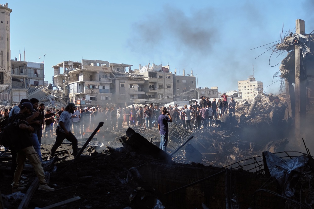 The aftermath of an Israeli strike in Gaza on Sunsay (AP)