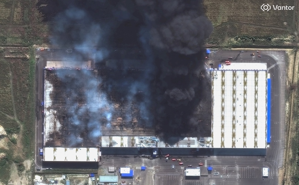 A satellite image shows smoke rising from an Ozon warehouse as Ukraine widens a campaign of drone strikes on Russian e-commerce companies, in Enem, Adygeya (Vantor)