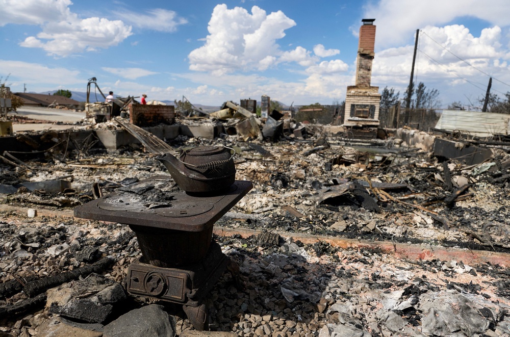 An old stove and teakettle next to a home that burned down during the Hawk Fire in Reno (Reuters)