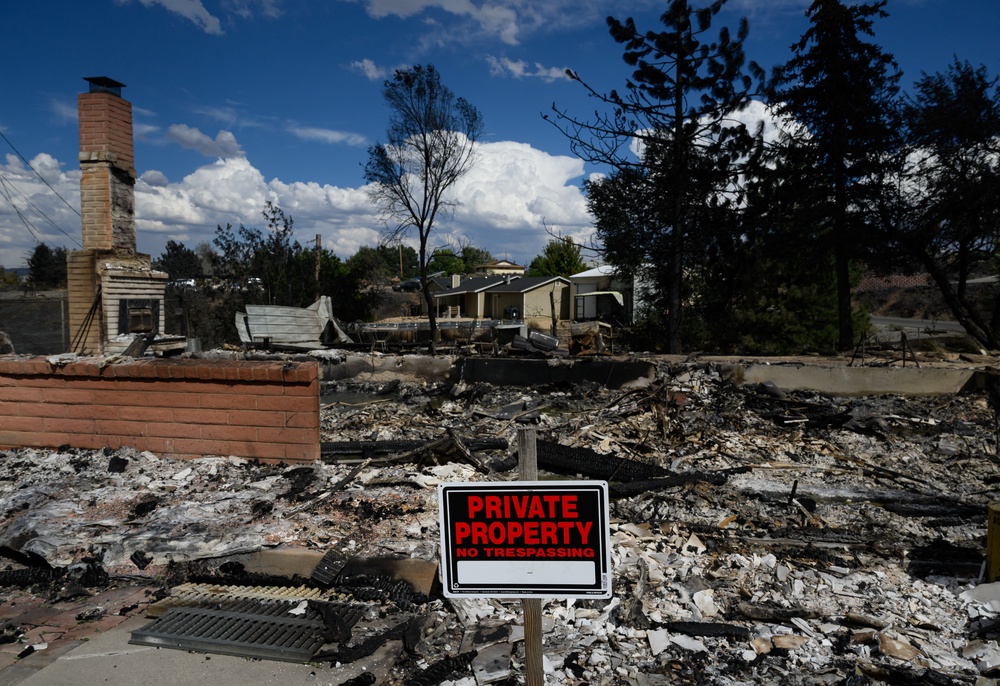 A burned home smolders after it was destroyed by the Hawk fire (AFP/Getty)
