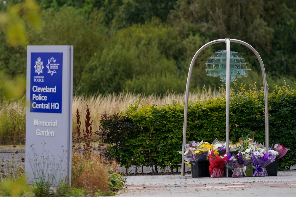 Flowers left at Cleveland Police Central Headquarters Memorial Garden after two police constables died (Getty)