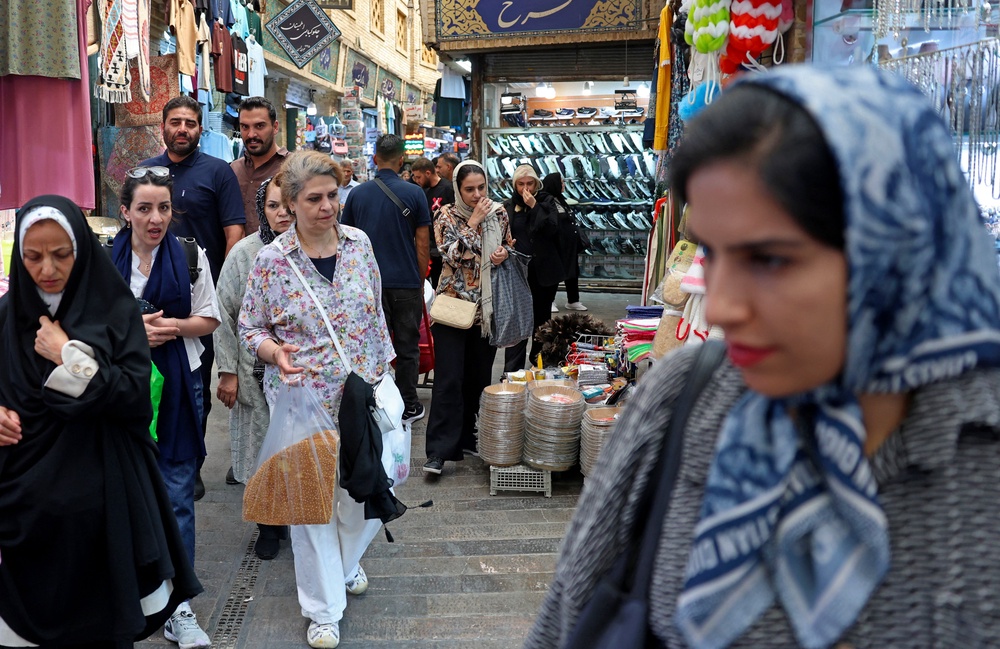 People shop for produce at the historic Tajrish bazaar in northern Tehran (AFP/Getty)