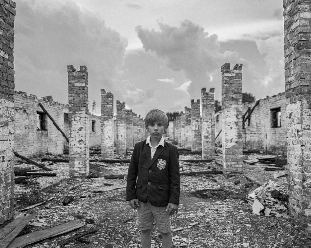 Harry chose ‘Schoolboy, destroyed farm, Kyiv region’ October 2022’ by Mark Neville for the exhibition (Mark Neville, courtesy of Postcard Ukraine/PA)