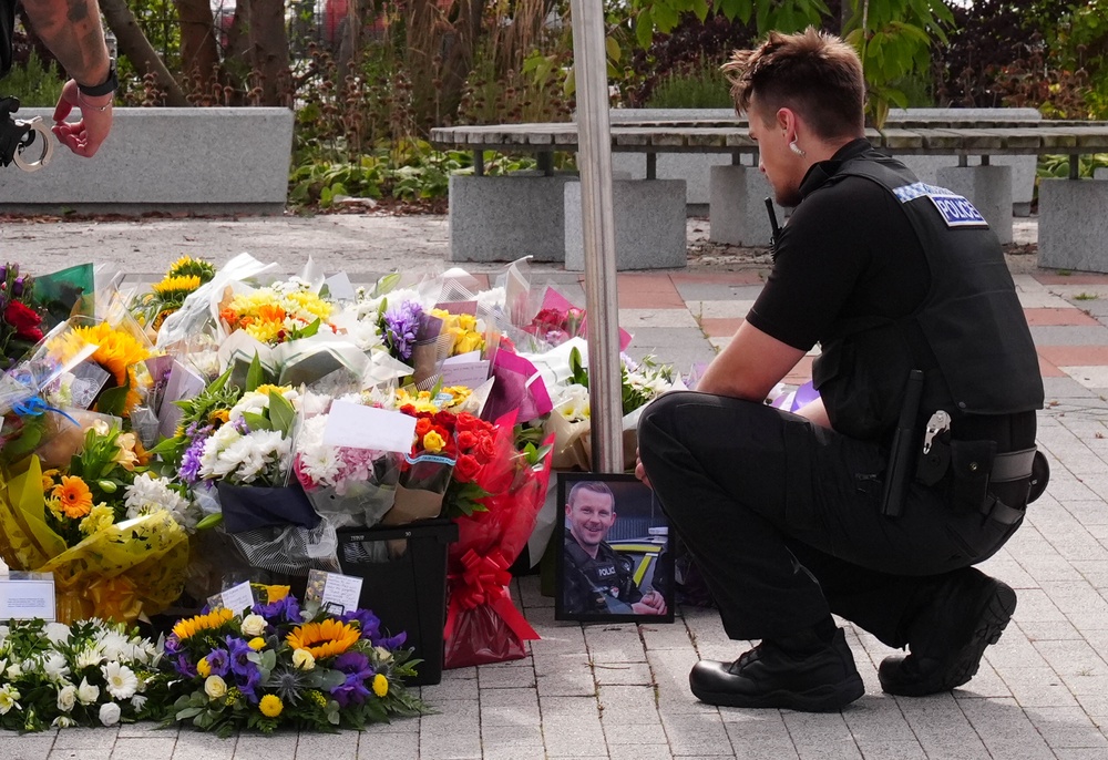 Flowers were laid in tribute to PC Matthew Blades and PC Tom Clough (PA)