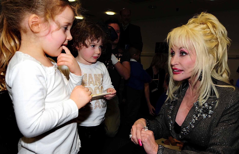 Dolly Parton's Imagination Library sent more than 200 million books to children across the world (PA)