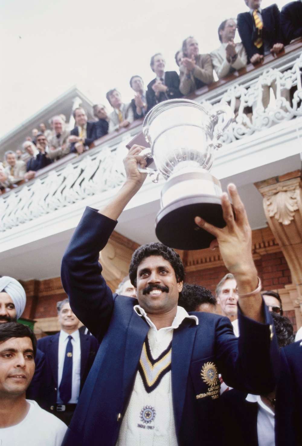 India all rounder Kapil Dev holds aloft the trophy on the balcony after the 1983 Cricket World Cup final  at Lords (Hulton Archive)