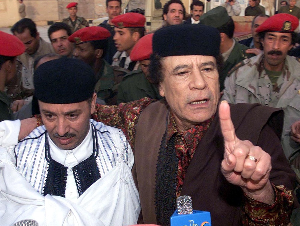 Libyan Al-Amin Khalika Fhimah (L) and Lybian leader Moamar Kadhafi speak to the press after Fhimah's arrival in Tripoli from The Netherlands (AFP/Getty)