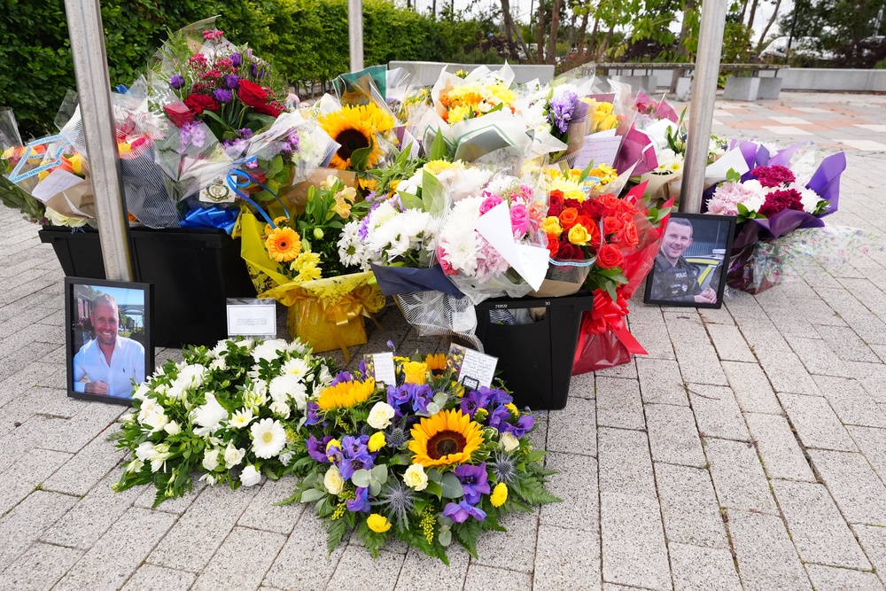 Flowers left at the Cleveland Police HQ in Middlesbrough (Owen Humphreys/PA) (PA Wire)