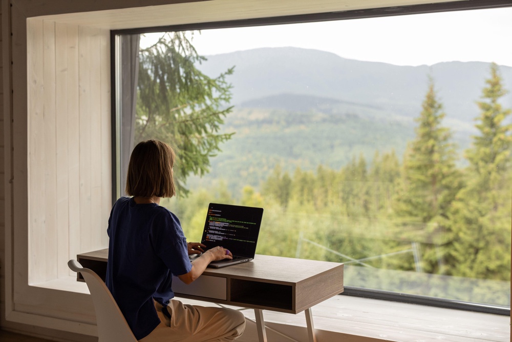 Positioning your workspace near a window can help reduce reliance on artificial lighting throughout the day, says Kirkman (PA)