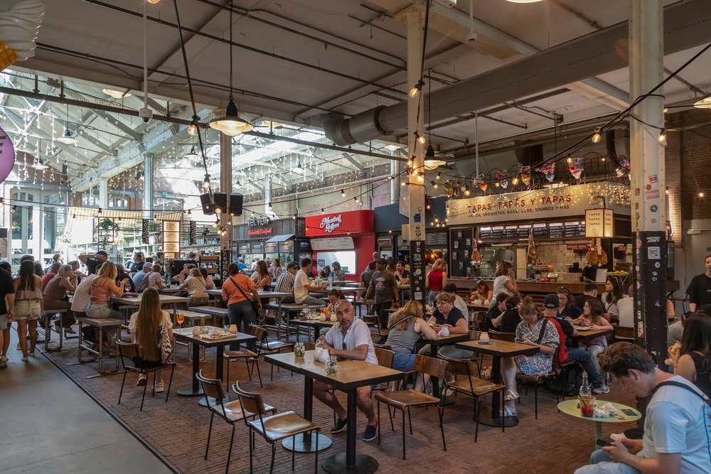 Foodhallen is a popular indoor food market located in a renovated historic tram depot (Getty Images)