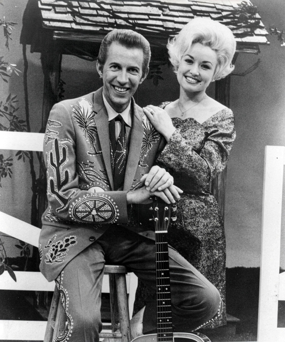 Country music stars Porter Wagoner and Dolly Parton in 1969 (Alamy/PA)