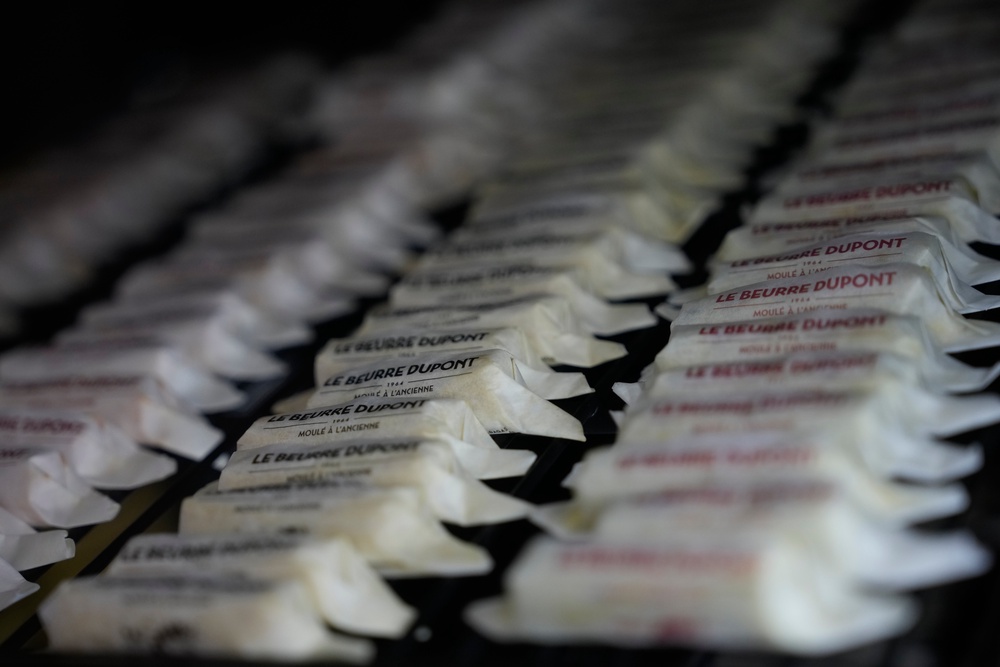 Packs of butter with different flavors are displayed in a refrigerator at Le Butter Shop (AP Photo/Christophe Ena)