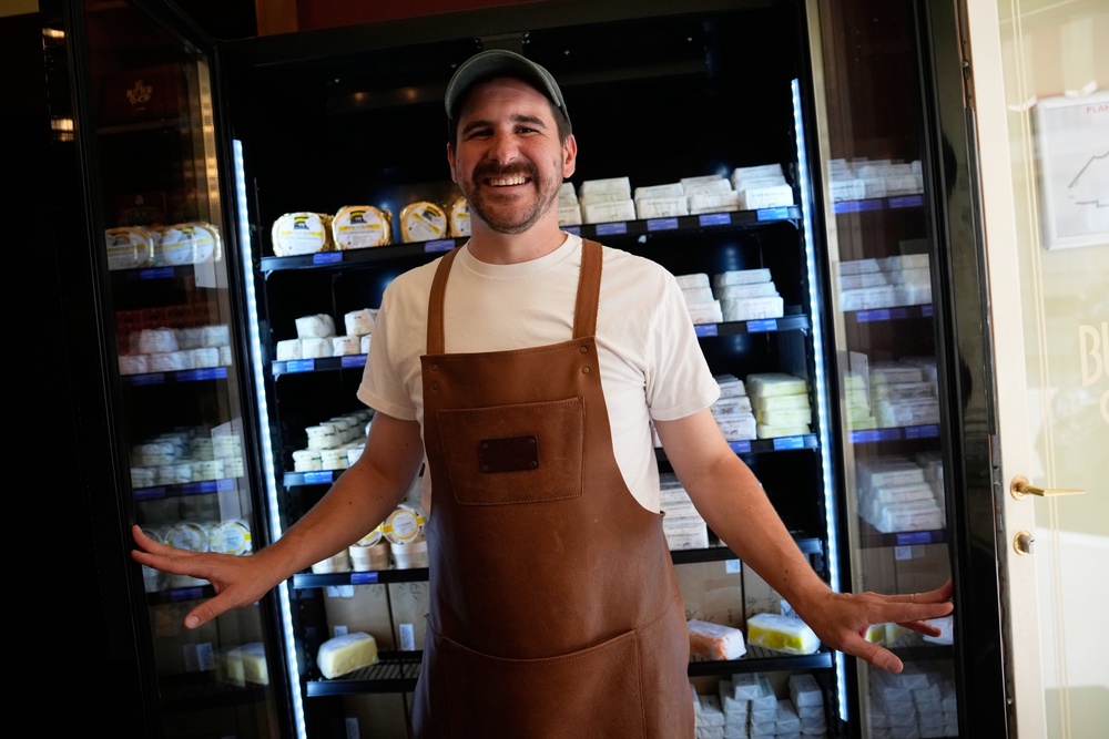 Owner of Le Butter Shop, Erwan Leo, poses in his first shop devoted entirely to butter in Paris, France (AP Photo/Christophe Ena)