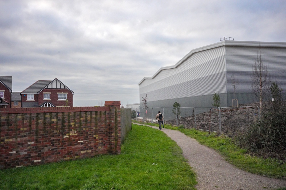 Houses are now dwarfed by the nearby warehouses (Getty)