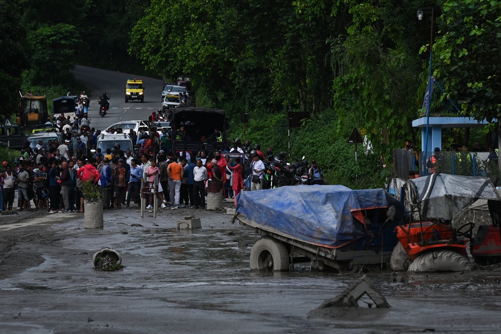 Houses and vehicles were swept away (AFP/Getty)