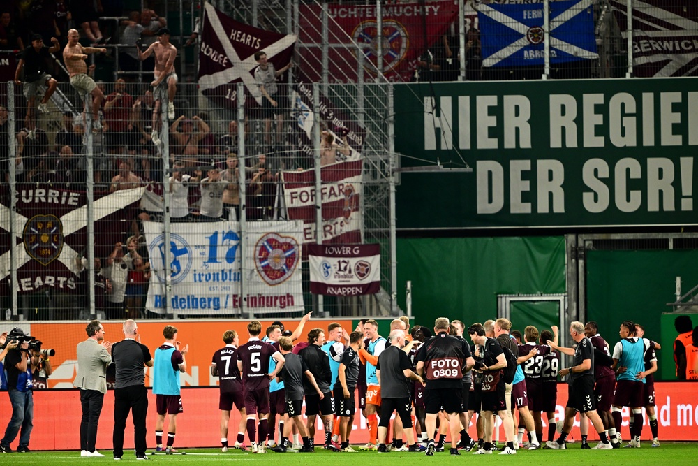 Hearts players celebrate in front of the away fans in Vienna (Getty)