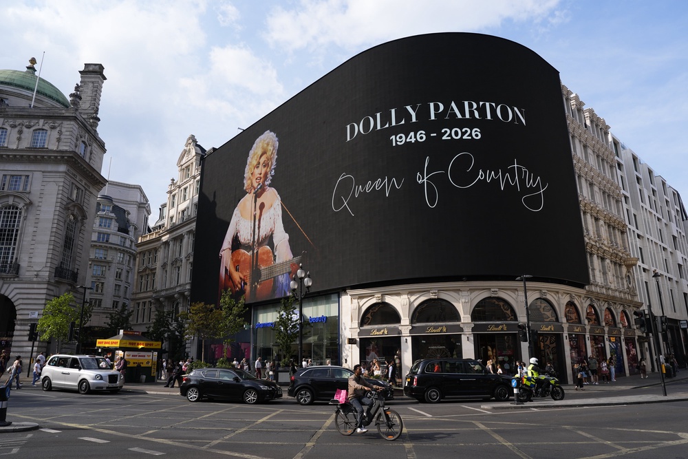 A screen billboard in the heart of London’s Piccadilly Circus has displayed a tribute to Dolly Parton (PA)