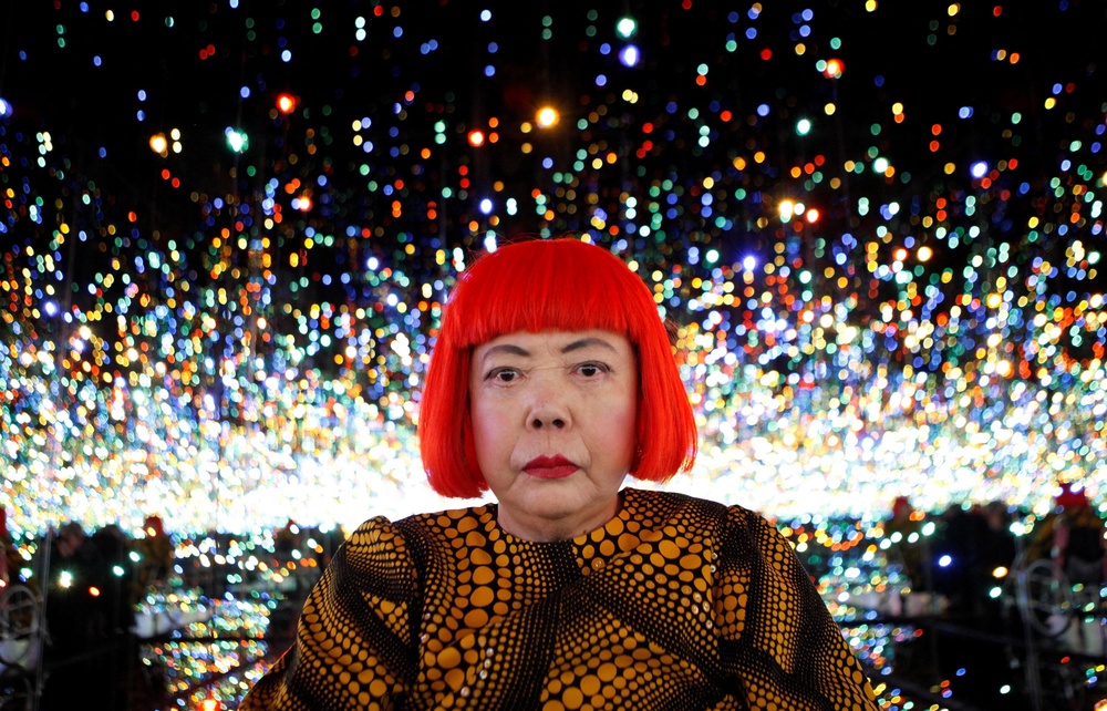 Yayoi Kusama poses for a photograph inside her Infinity Mirrored Room installation titled ‘The Souls of Millions of Light Years Away.’ (Reuters)