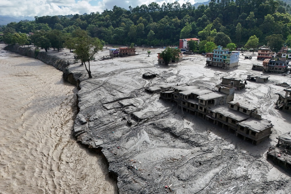 A drone view shows mud covering buildings and property following devastating floods at Trishuli in Nuwakot district (Reuters)