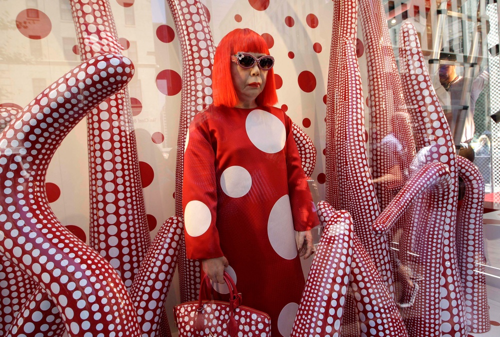 A wax model of Japanese artist Yayoi Kusama is displayed in the windows of Louis Vuitton's flagship Fifth Avenue store in New York. (Copyright 2026 The Associated Press. All rights reserved.)