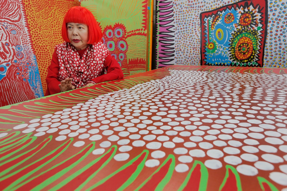 Yayoi Kusama speaks during an interview at her studio, filled with wall-sized paintings throbbing with her repetitive dots, in Tokyo. (Copyright 2026 The Associated Press. All rights reserved.)