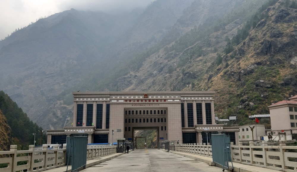 This general view, taken on April 30, 2023, shows the under-construction Gyirong Port Building in the Tibet Autonomous Region and the Friendship Bridge on the Nepal-China Border at Rasuwa, before the area was inundated with floodwaters on August 26, 2026 (AFP/Getty)