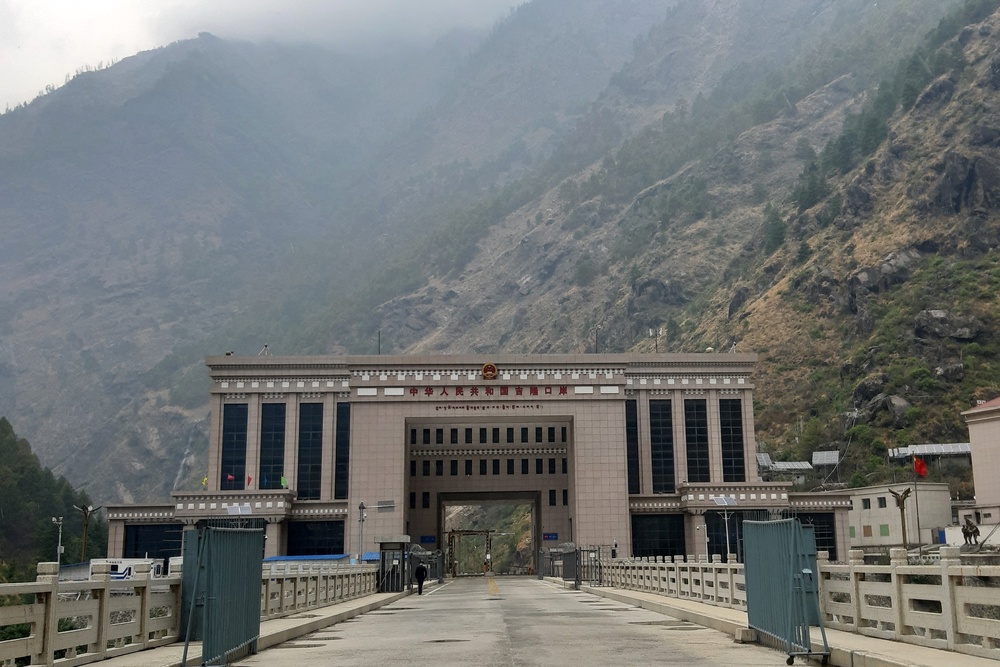 This general view, taken on April 30, 2023, shows the under-construction Gyirong Port Building in the Tibet Autonomous Region and the Friendship Bridge on the Nepal-China Border at Rasuwa, before the area was inundated with floodwaters on August 26, 2026 (AFP/Getty)