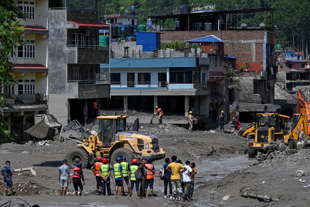 Bulldozers clear mud and debris at Trishuli in Nepal (AFP/Getty)