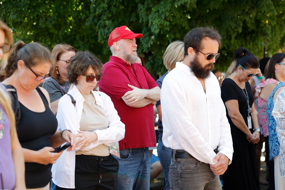 Dolly Parton fans attend a moment of silence at The Dolly Parton Statue in Sevierville, Tennessee on Wednesday (Getty Images)
