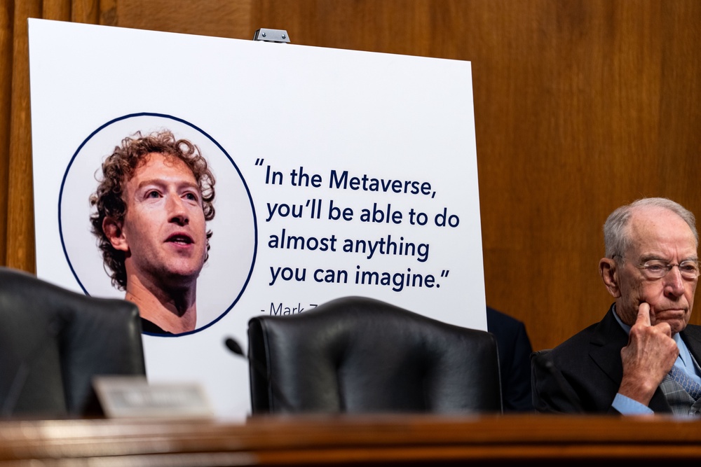 A poster of Meta CEO Mark Zuckerberg is displayed as former Meta researchers Jason Sattizahn and Cayce Savage testify during a Senate Judiciary Subcommittee on Privacy, Technology, and the Law hearing titled 