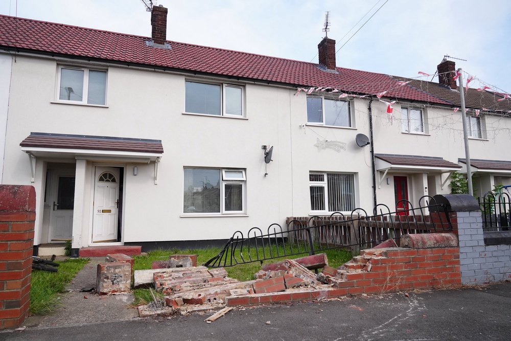 The scene at Steele Crescent, South Bank, as police are investigating reports of a vehicle crashing into a wall at a house near Middlesbrough (Owen Humphreys/PA) (PA Wire)