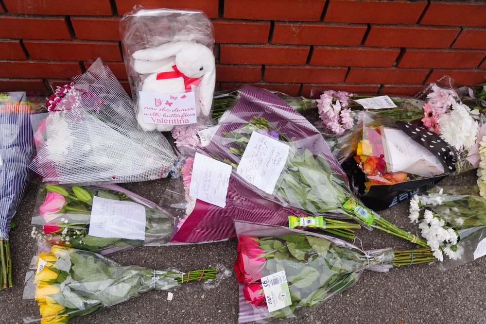 Flowers at the scene on Birchington Avenue, near Middlesbrough, where Valentina Foster, aged seven, and Natalie McDonald, 34, died after a fire (Owen Humphreys/PA) (PA Wire)
