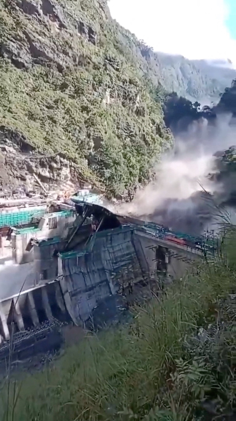 Hydroelectric dam under construction on the Trishuli river overwhelmed by wall of floodwater (Reuters)