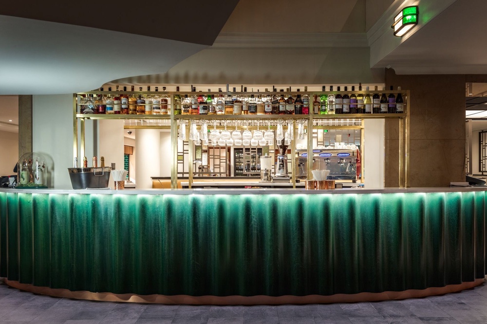 The hotel’s vibrant green bar is another Art Deco-inspired feature (Hilton)