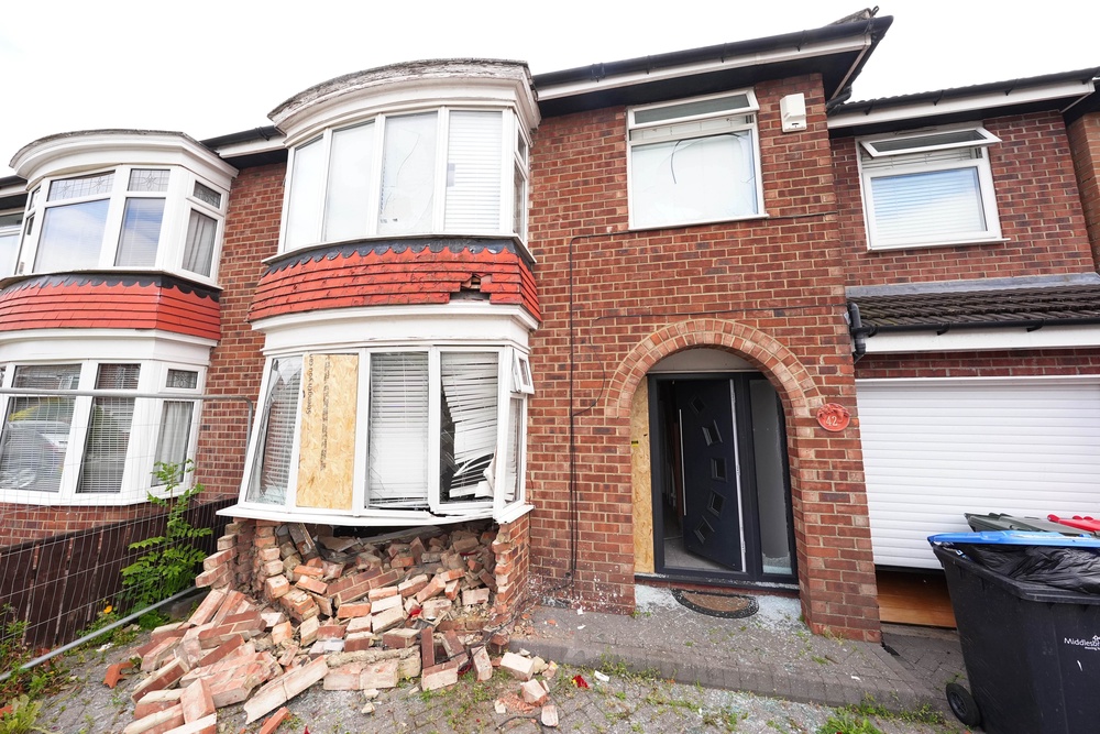 A house in Ruskin Avenue, Middlesbrough, after being rammed by a car, which deliberately reversed into the front window, causing extensive damage (Owen Humphreys/PA) (PA Wire)