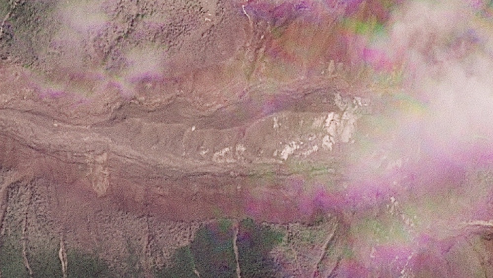 A satellite view shows a buildup of a lake at the site of the glacier collapse (Reuters)