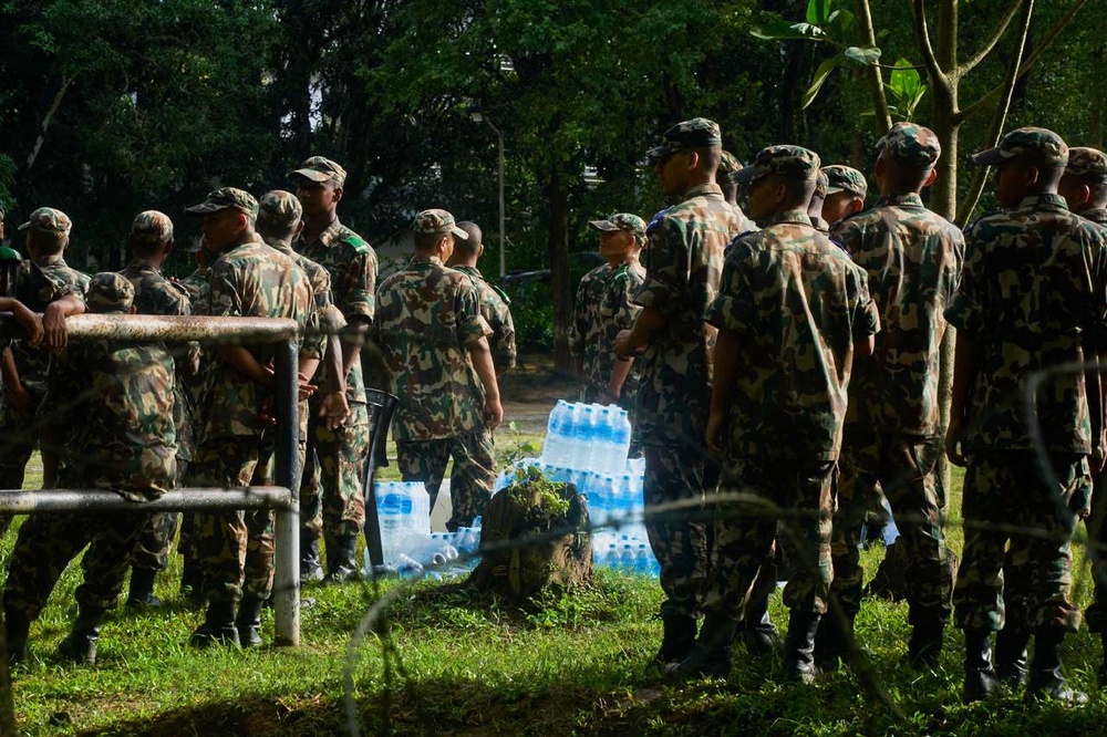 Nepalese army soldiers stand in the aftermath of flash floods in Devighat (Niranjan Shrestha/AP) (AP)