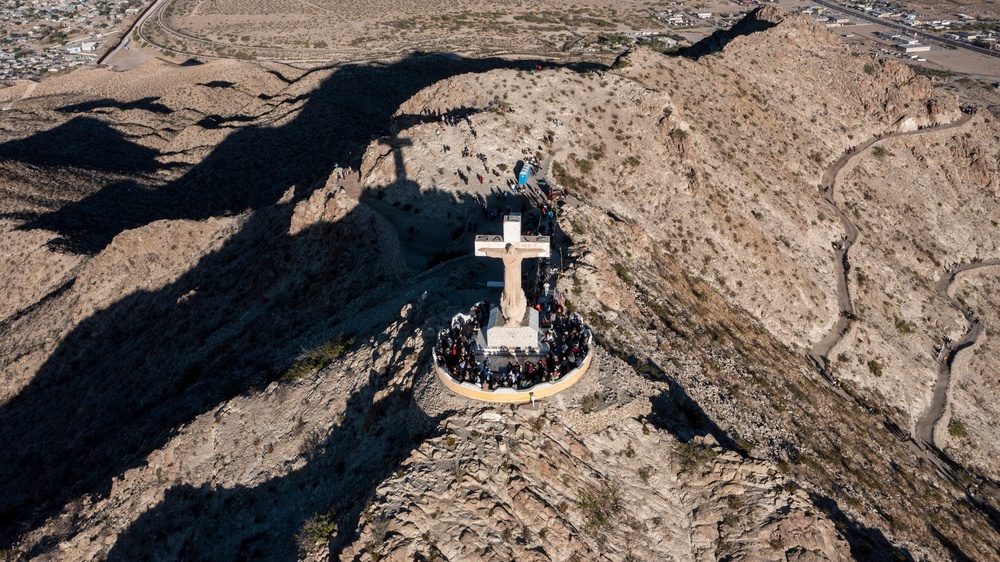 The monument attracts hundreds of pilgrims each year — as well as vandals who have broken the statue and tagged it with graffiti, which volunteer groups help clean (Reuters)