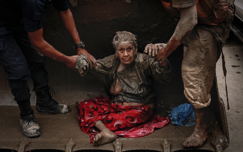 A survivor is transported to a safer place following flash flood and mudslide at Trishuli (Reuters)