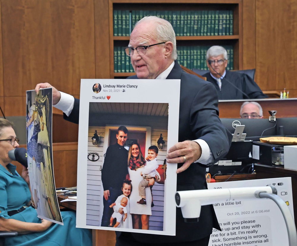 Defense attorney Kevin Reddington holds up a picture of th Clancy family before the murders during closing arguments (USA Today 2026)