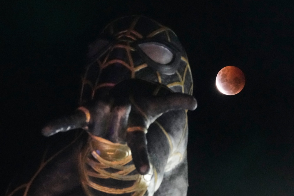 The moon rises behind a Spider-Man statue in El Alto, Bolivia. (AP)