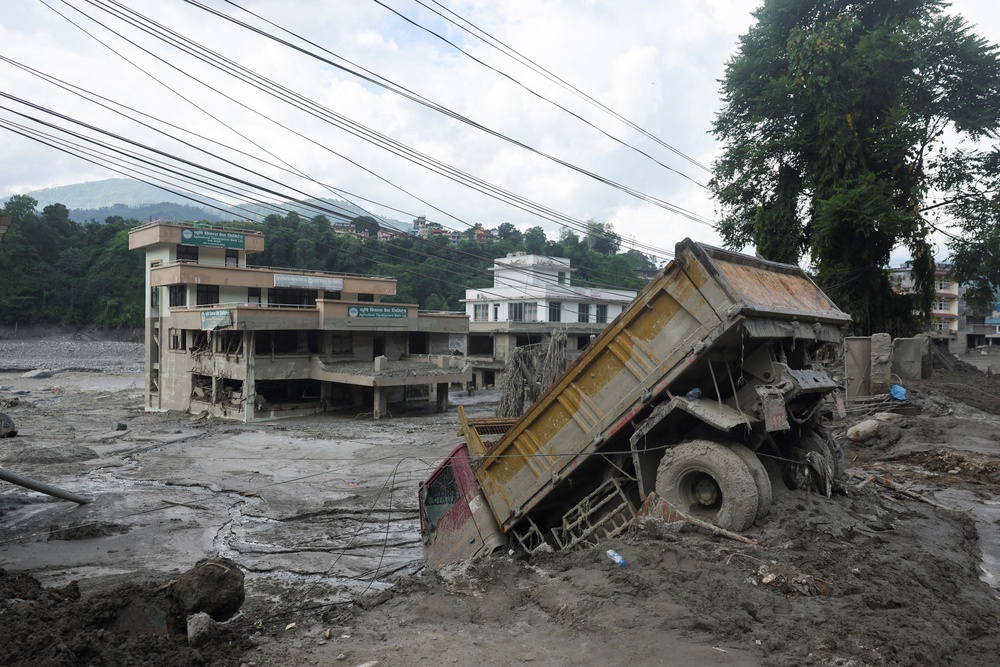 Aftermath of flash floods and mudslide at Trishuli Bazaar army training centre in Nuwakot (Reuters)