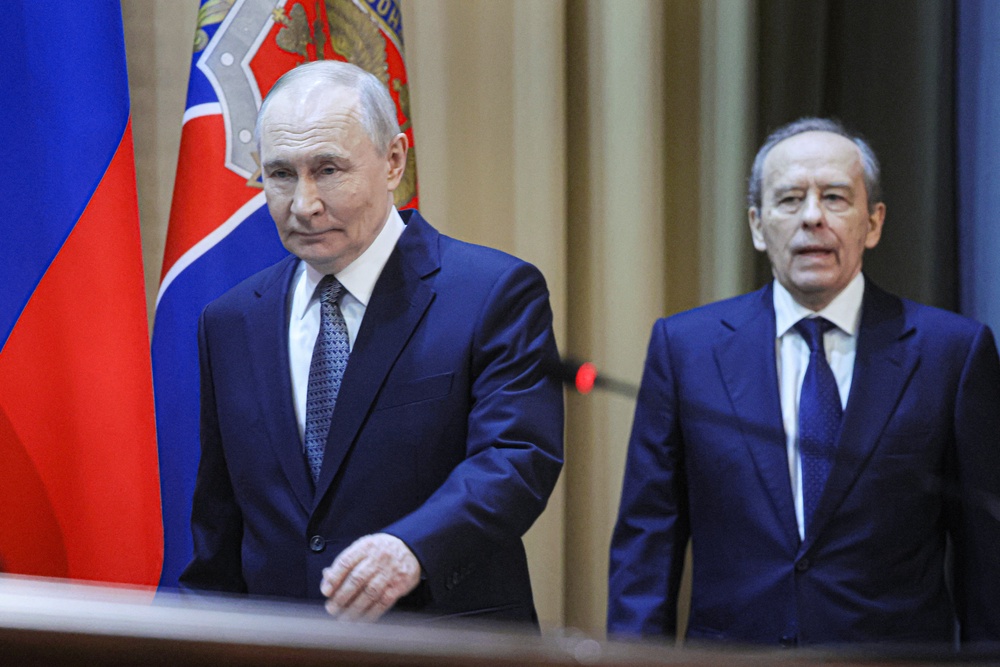 Alexander Bortnikov (right), the director of the FSB, met with Ratcliffe. President Putin (left) was briefed on the talks but did not attend (AFP/Getty)