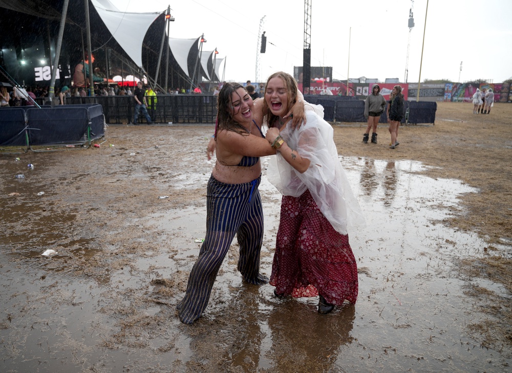Festival-goers were frolicking in the rain during the Reading Festival (Jeff Moore/PA) (PA Wire)