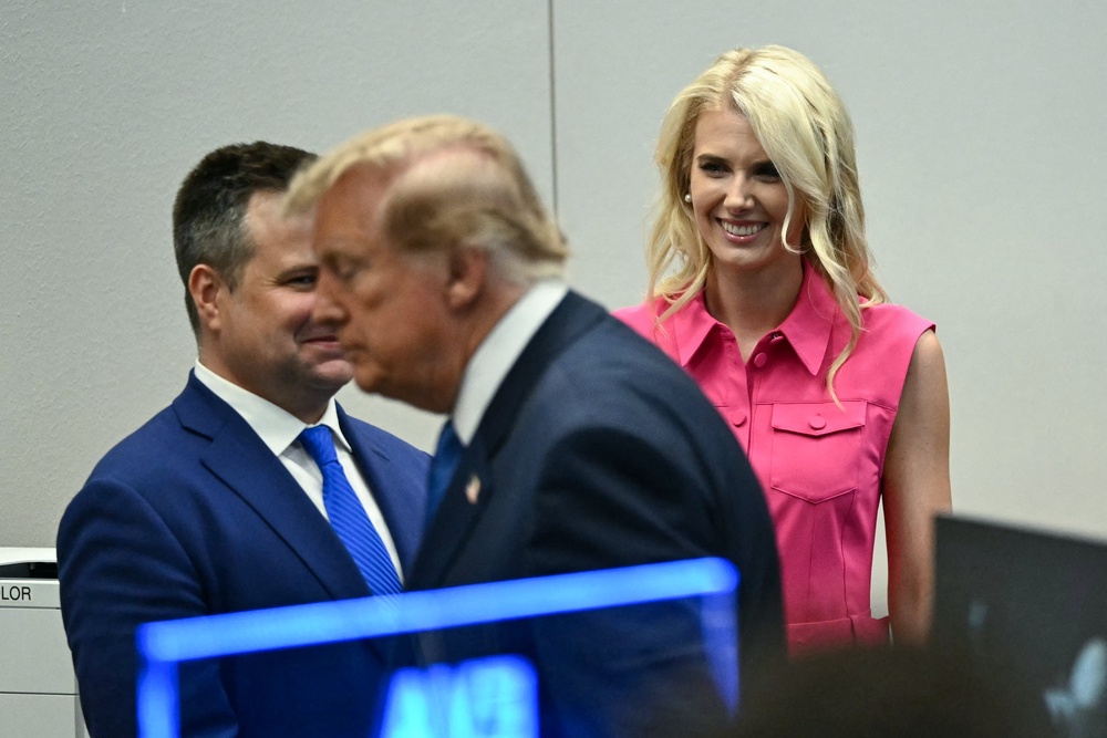 A regular presence alongside Trump, Harp is known to carry a portable printer to produce hard copies of favorable news articles and social media posts (AFP/Getty)