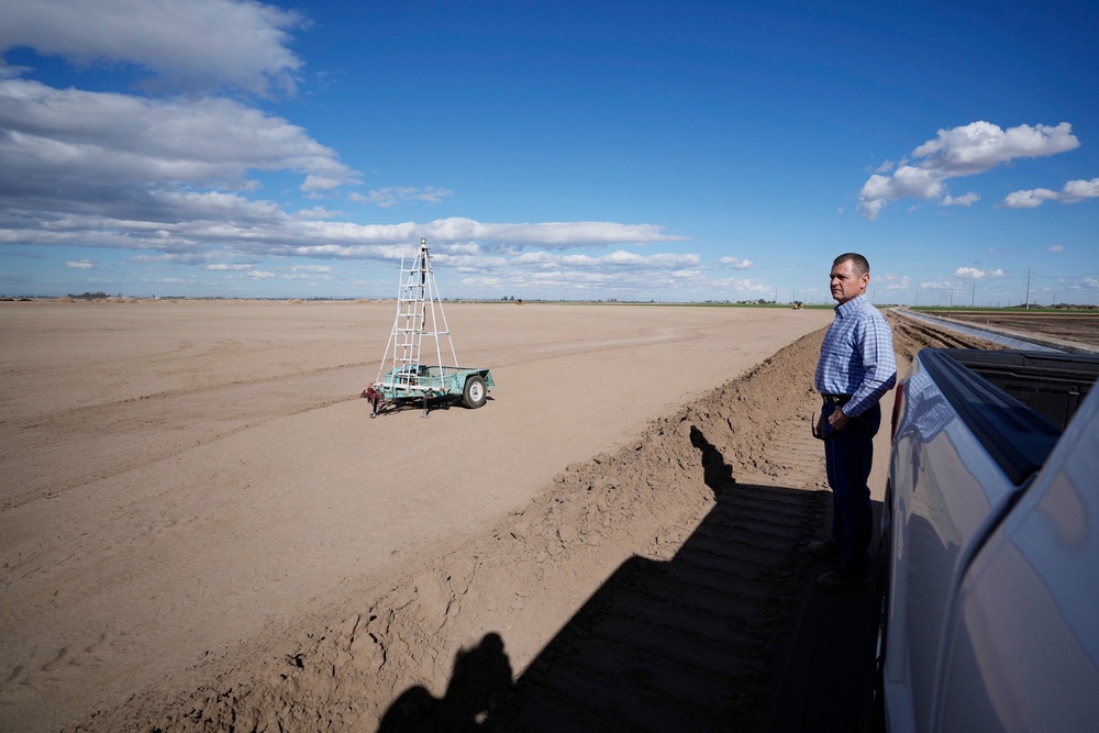 Tom Brundy looks over his field that is being prepared for planting near Calexico, California (Copyright 2023 The Associated Press. All rights reserved)