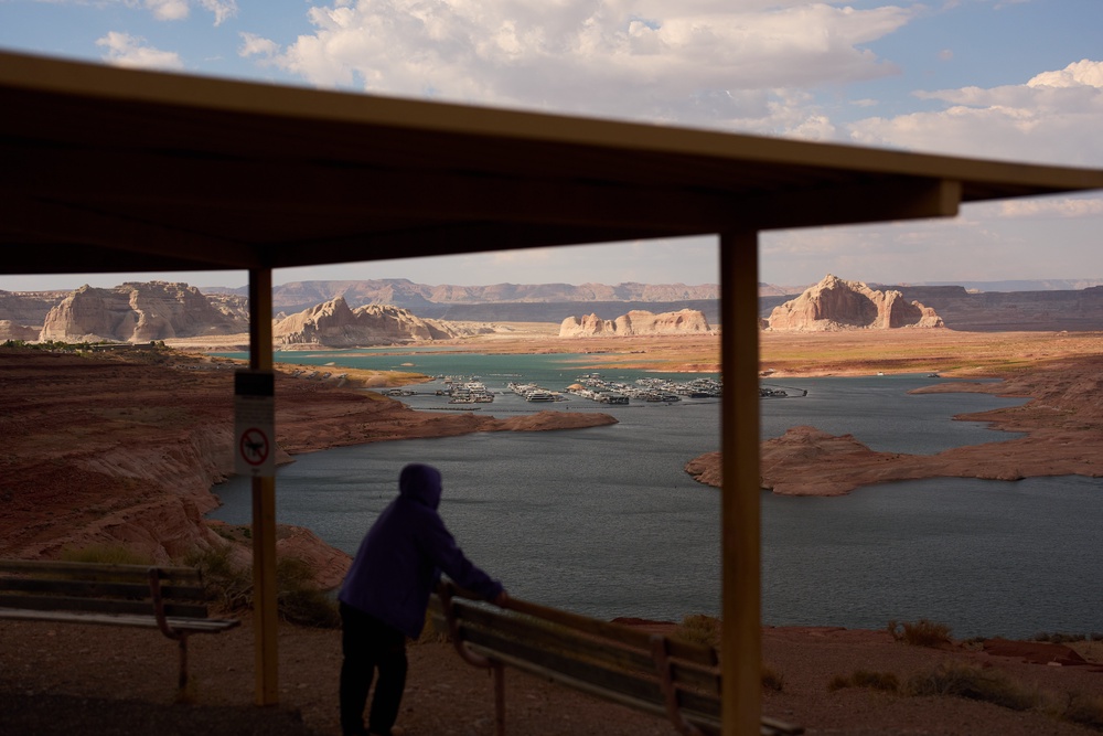A person stands at an overlook near the Wahweap Marina on Lake Powell at the Glen Canyon National Recreation Area (Copyright 2026 The Associated Press. All rights reserved.)