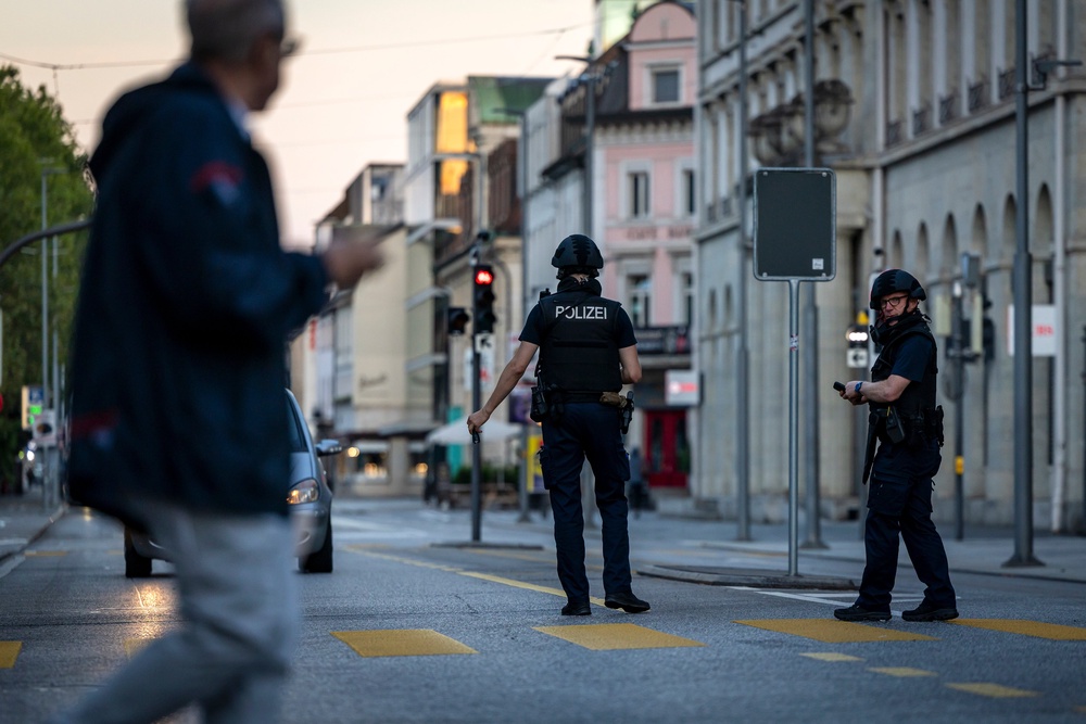 Police officers patrol a street in downtown Aarau, Switzerland Sunday (© KEYSTONE / MICHAEL BUHOLZER via AP)